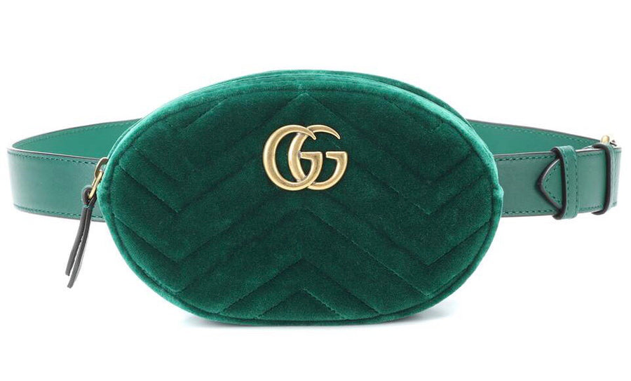 Gucci luxury handbag with belt.